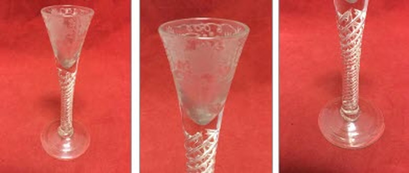 Picture Railtons July Auction, Lot 365. An eighteenth century wine glass, the funnel shaped bowl engraved with vine frieze above a mercury multiple twist stem, raised on conical foot with rough pontil mark.