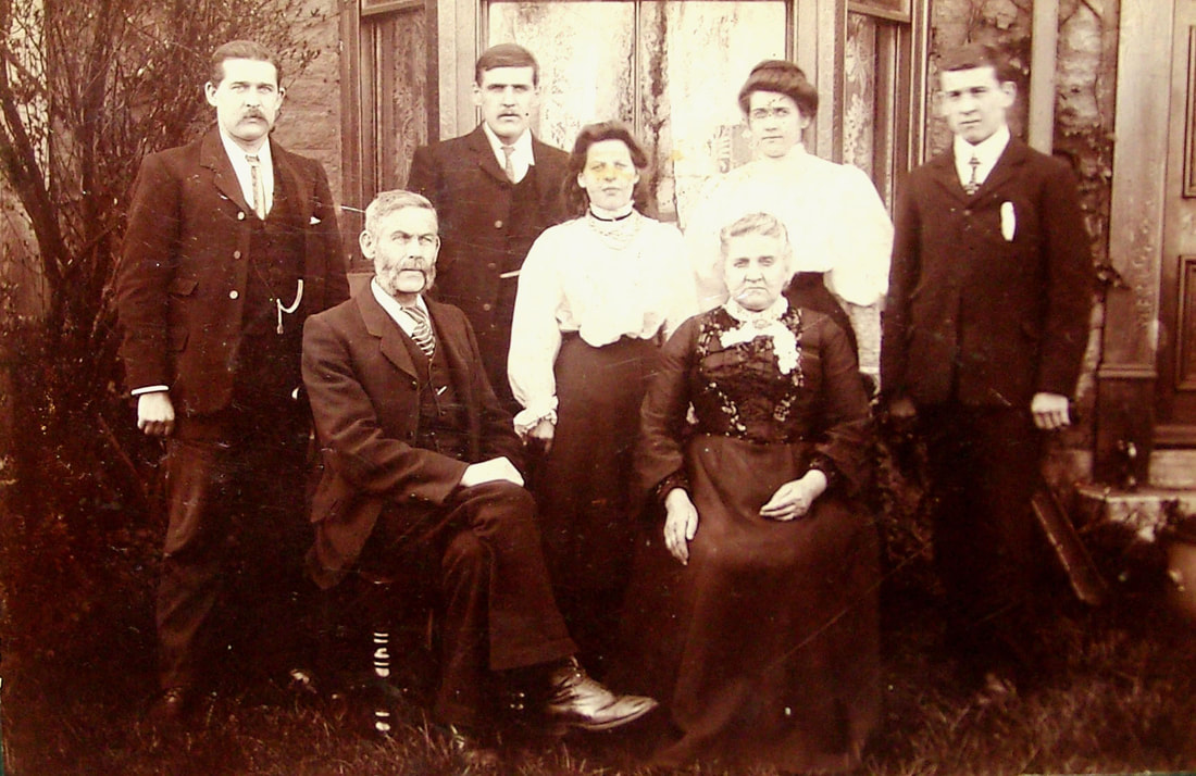 Picture  Andrew Pearcy b. 1848, Wooler with his wife Margaret Turnbull and five of their children.  David's grandfather 'Jack' Pearcy b.1885 is on the back row extreme right.