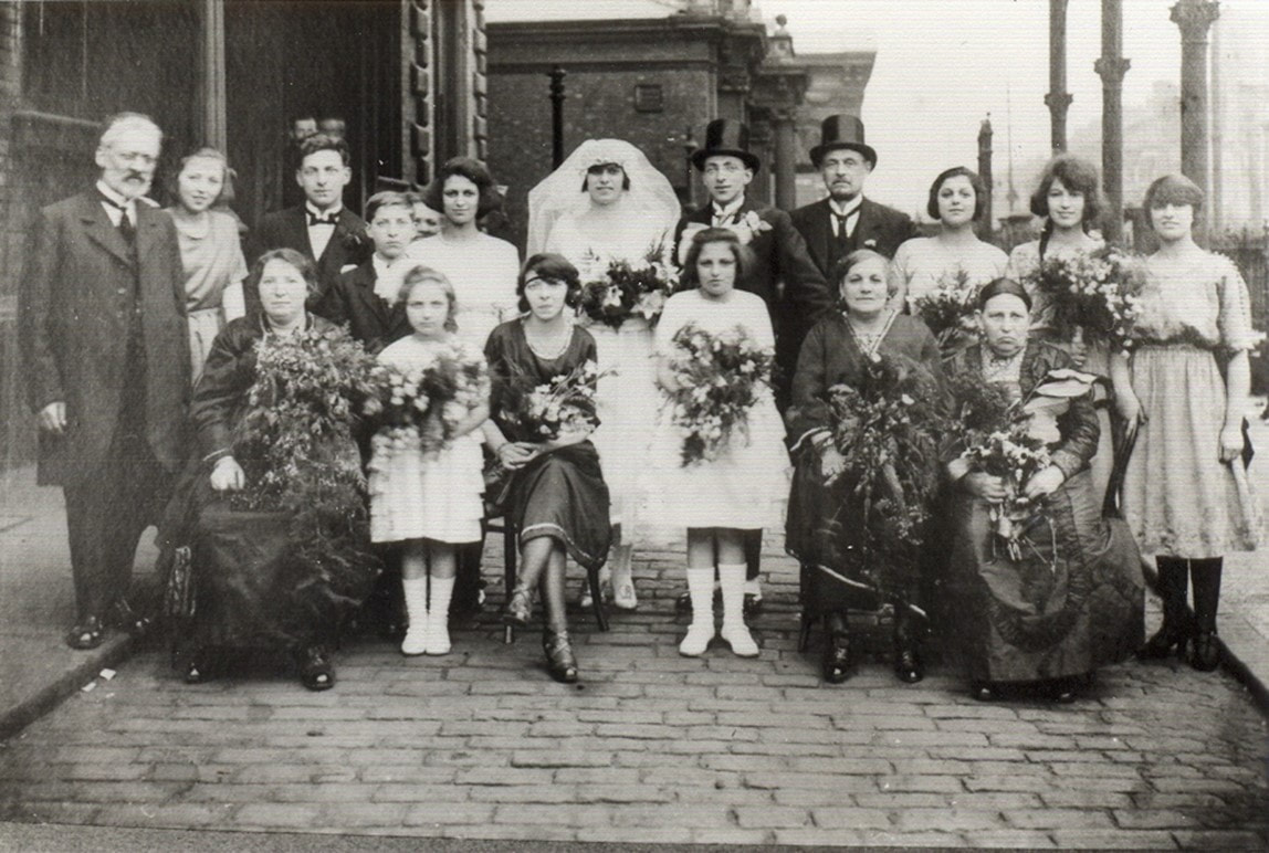 Picture Abe Freedman's marriage to Emma Simon in June 1921.  Wonderful example of 1920s wedding photo and fashion - brides headdress, very large bouquets, serious faces and lack of hats for women.